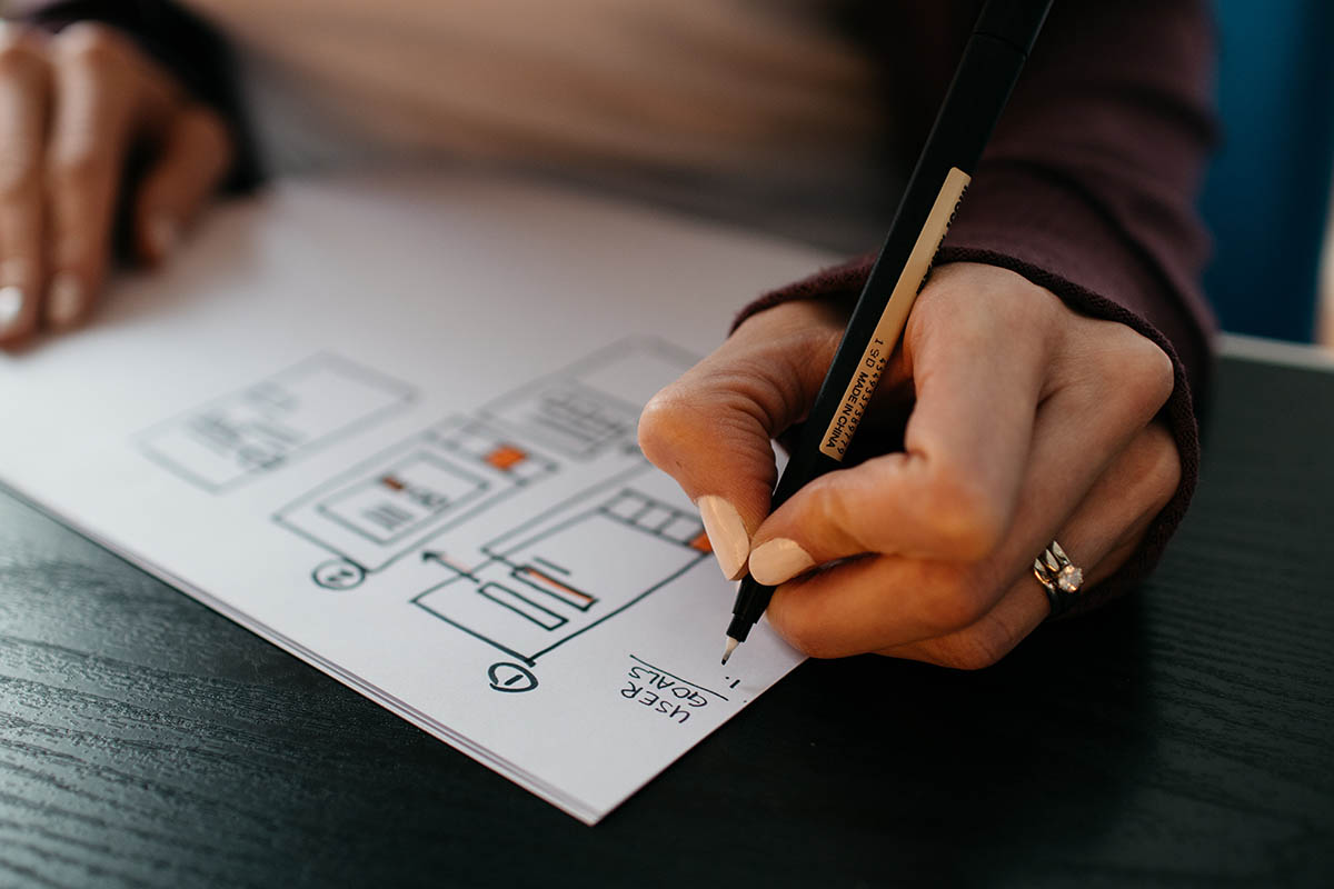 Woman setting website design goals