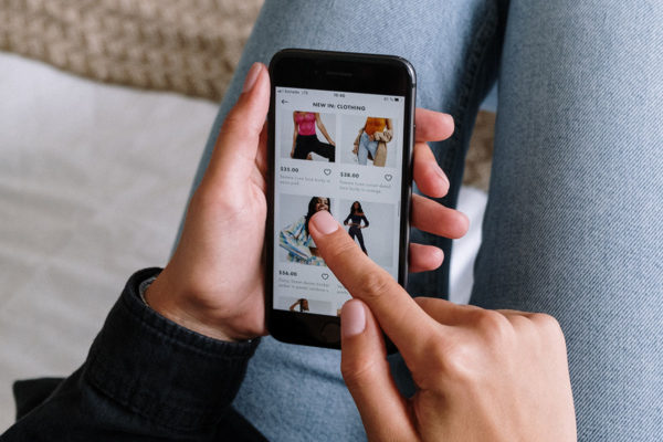 woman shopping on ecommerce mobile website